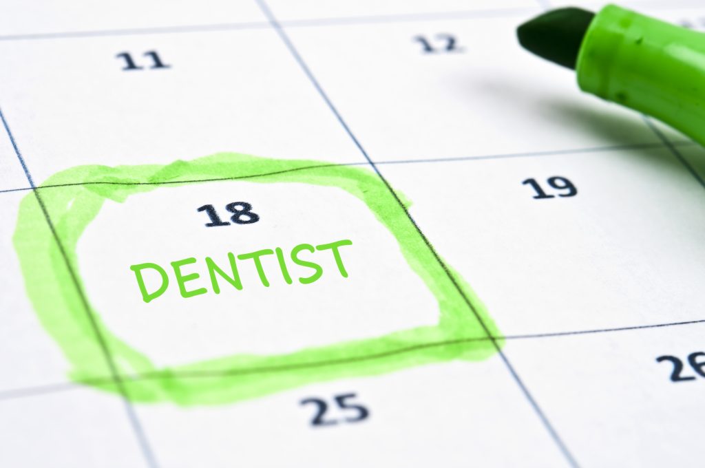 Incorporating on-hold music and messaging is more than just a courtesy; it’s a strategic tool that can significantly enhance patient experience and satisfaction - calendar with date circled and word dentist written in to convey making a dental appointment - on hold marketing concept