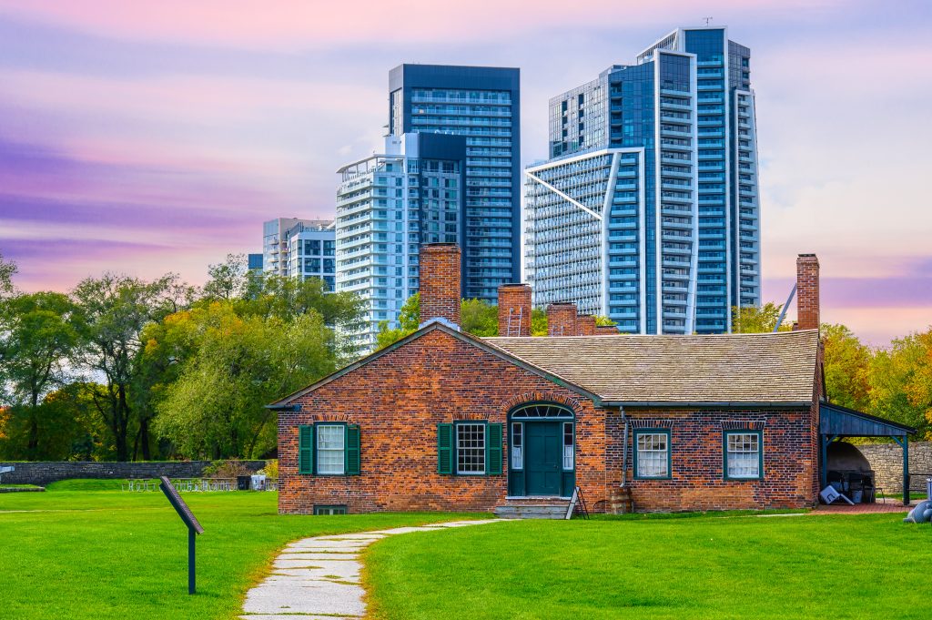 Remembrance Day is a pivotal moment for reflection, understanding, and community engagement in Canada - Image of Fort York in front of the Toronto skyline - Fort York is a National Historic Site of Canada